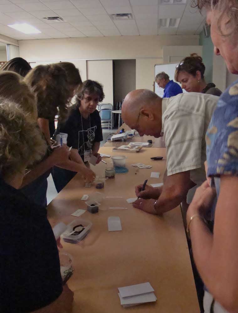 Desert Garden Institute Wildflower Workshop participants label wildflower seeds to take home September 17 2001. by Eileen M. Kane is licensed under CC BY SA 2